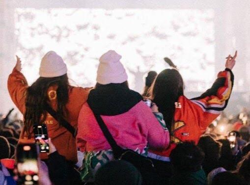 three girls in a festival